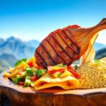 Plato de carne asada con verduras y couscous